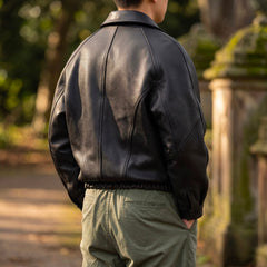 Men's black leather jacket with zipper and elastic hem